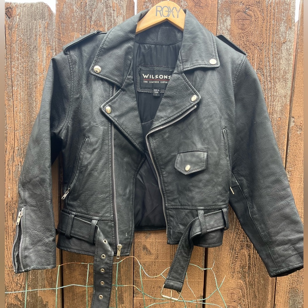 Wilson’s leather biker jacket in black with Harley Davison patch